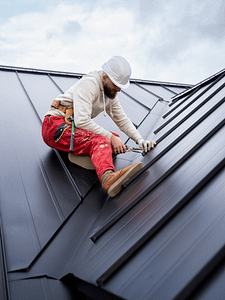 Worker Installing Roof Worker Installing Roof
