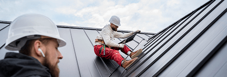 Worker Installing Roof Worker Installing Roof
