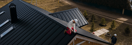 Worker Installing Roof Worker Installing Roof
